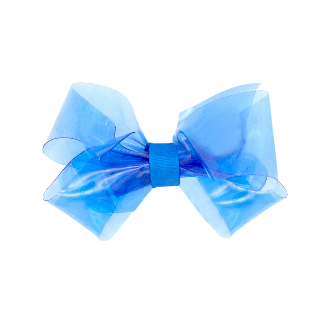 Assortment of Wee Ones hair bows including grosgrain bow headband and waterproof vinyl bows in bright colors, displayed on a soft white surface at Cuddles and Carriages in Evans, Georgia.