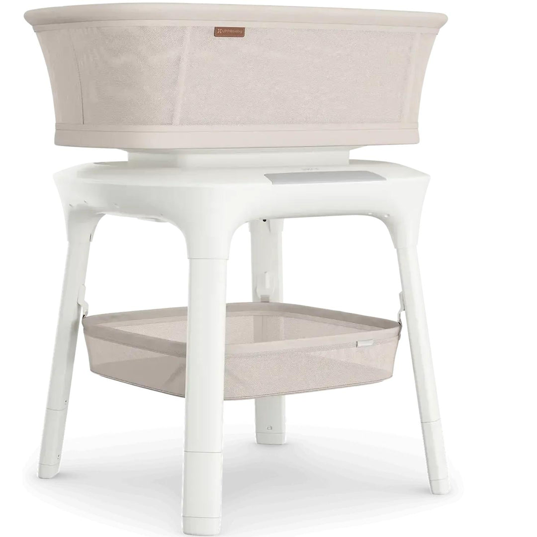 UPPAbaby Soma Smart Bassinet beside a bed — one of 2026's best baby bassinets and bedside sleepers