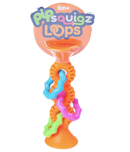 Colorful Fat Brain Toys sensory collection including pipSquigz Loops and Dimpl Stack arranged on a wooden play surface at Cuddles and Carriages in Evans, Georgia
