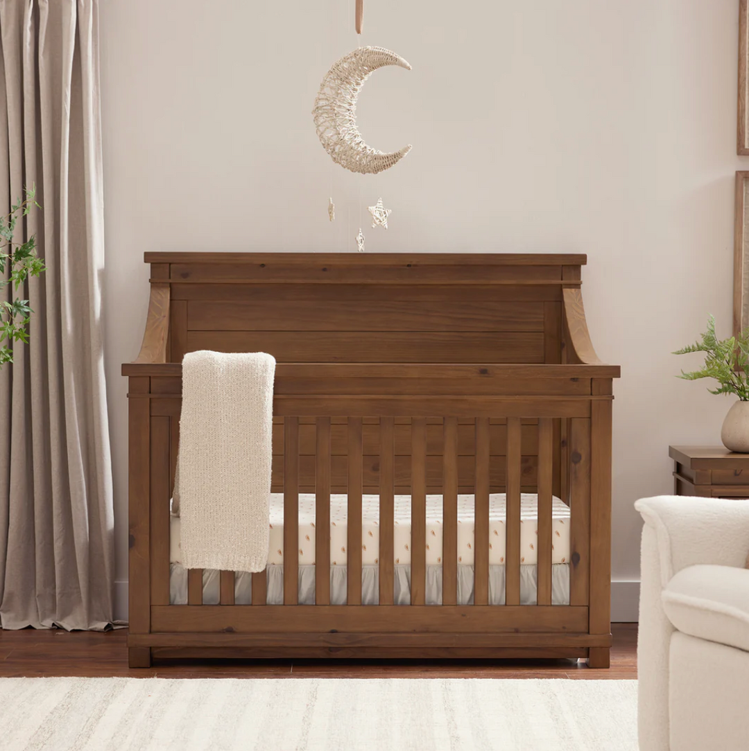 Appleseed Rowan Flat-Top Convertible Crib in solid wood, styled in a nursery