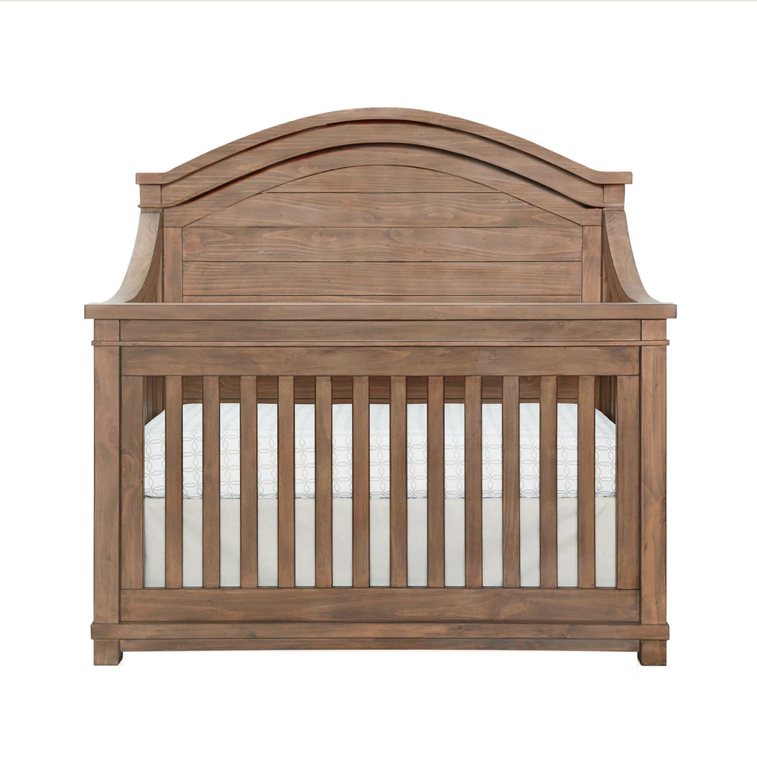 Appleseed Rowan Arch Top solid-wood convertible crib in a styled nursery