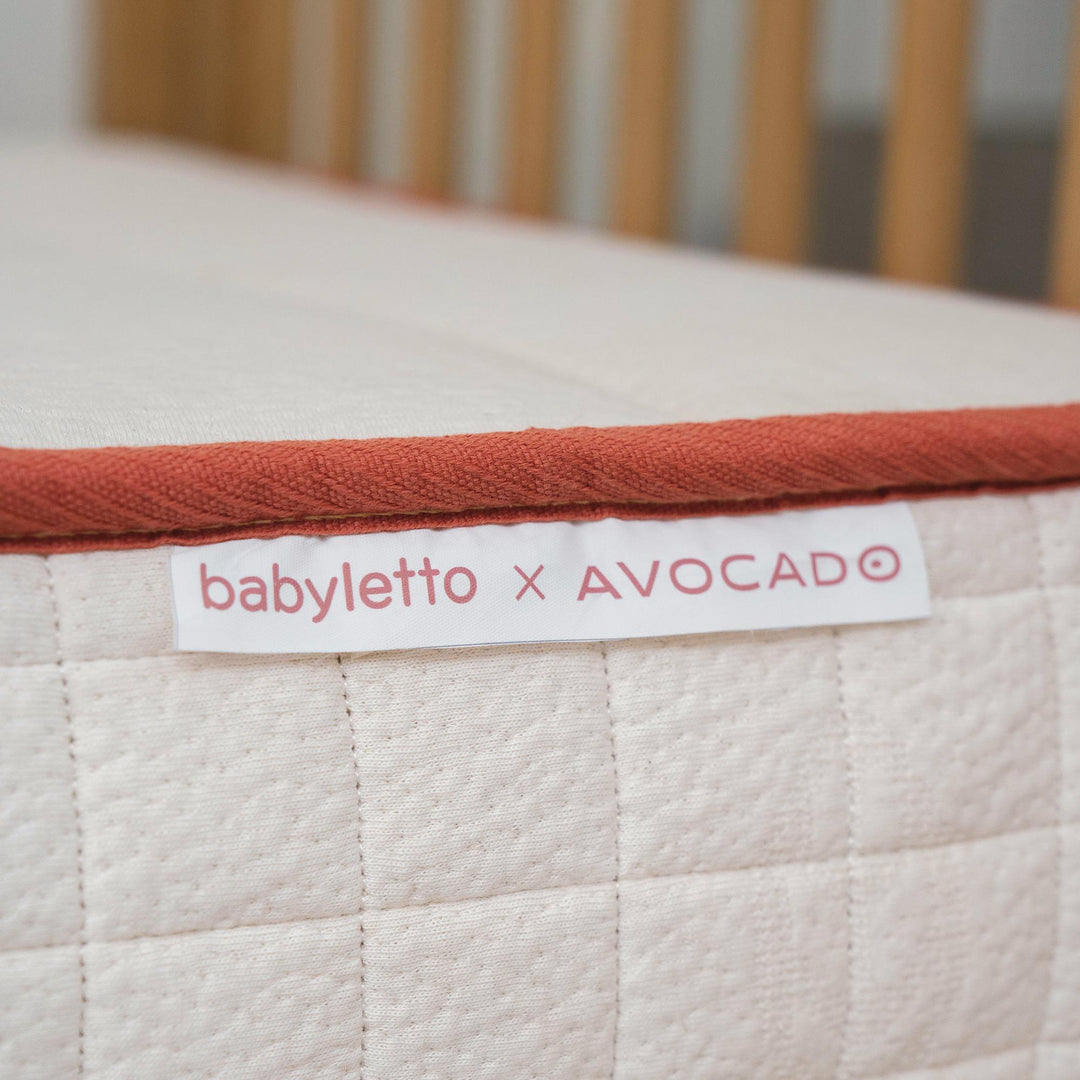 Babyletto x Avocado dual-stage organic crib mattress with a firm infant side for safe infant sleep
