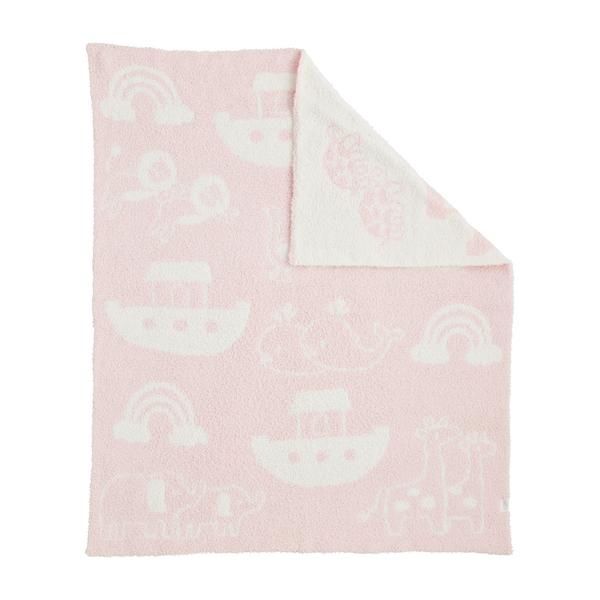 Pink blanket with white cloud and rainbow patterns on a white background
