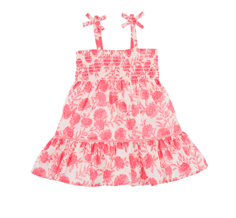 Pink floral dress with bow straps on a white background