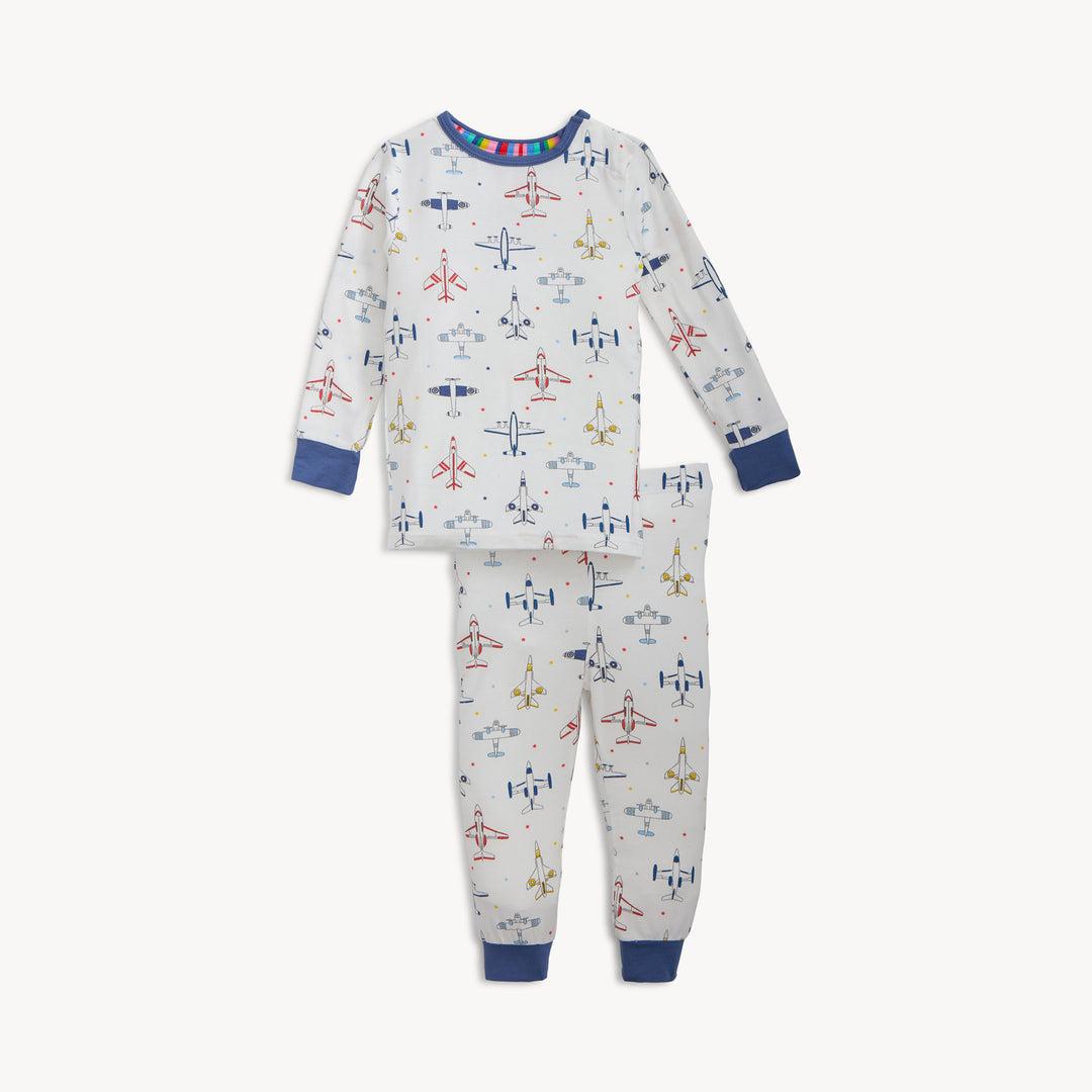 Children's pajama set with airplane pattern on a white background